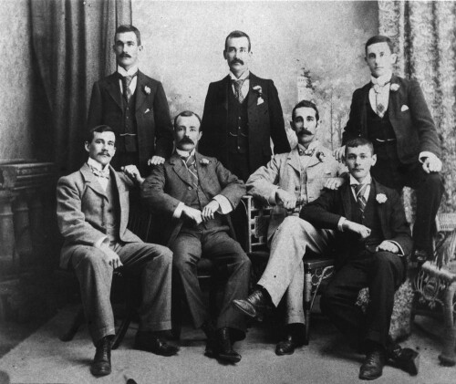 StateLibQld_2_167751_Group_of_men_wearing_three-piece_suits_posing_for_a_portrait_1890-1900.jpeg